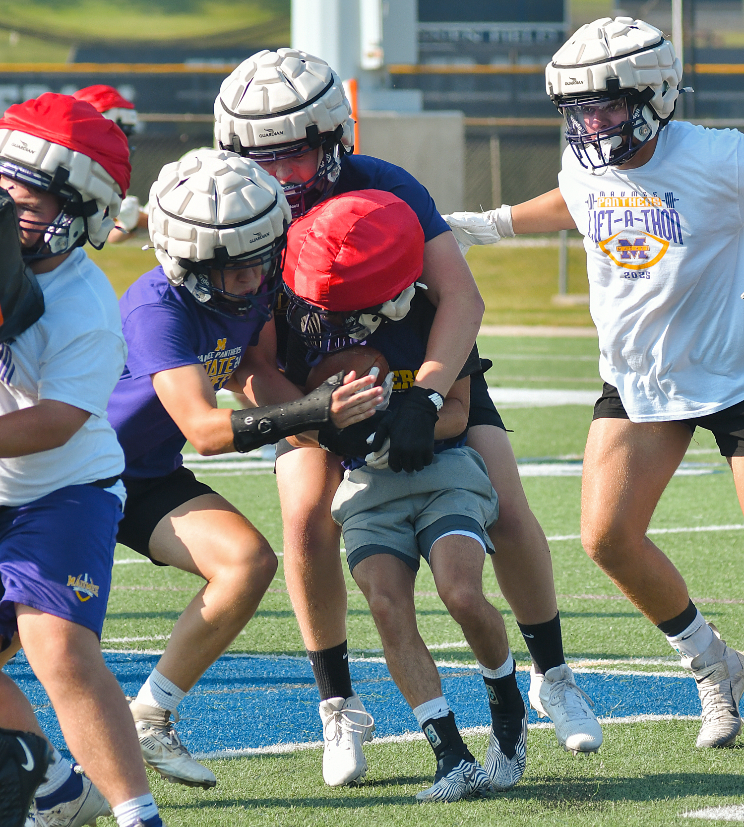 Panthers add Guardian Caps to practice gear to aid player safety